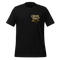 A black short-sleeve crewneck t-shirt with a distressed gold graphic on the left chest that reads 'CAN WE PRAY?'